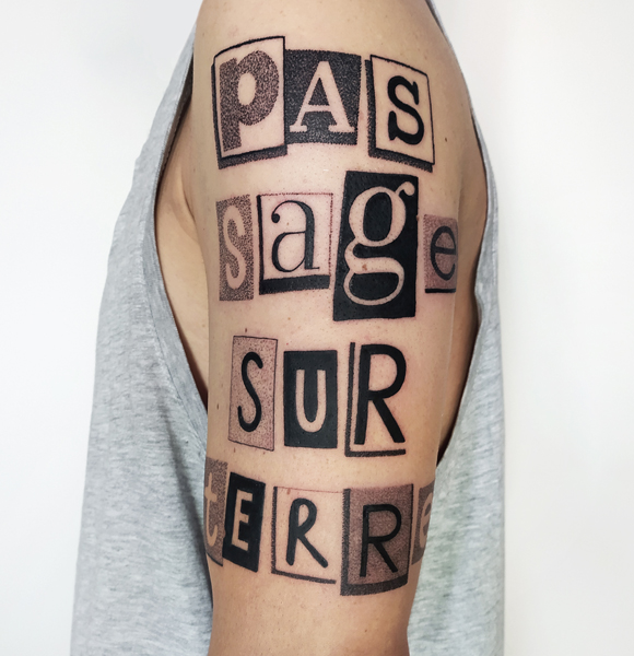 Ce que je tatoue : photographie d'un tatouage texte "pas sage sur terre"
